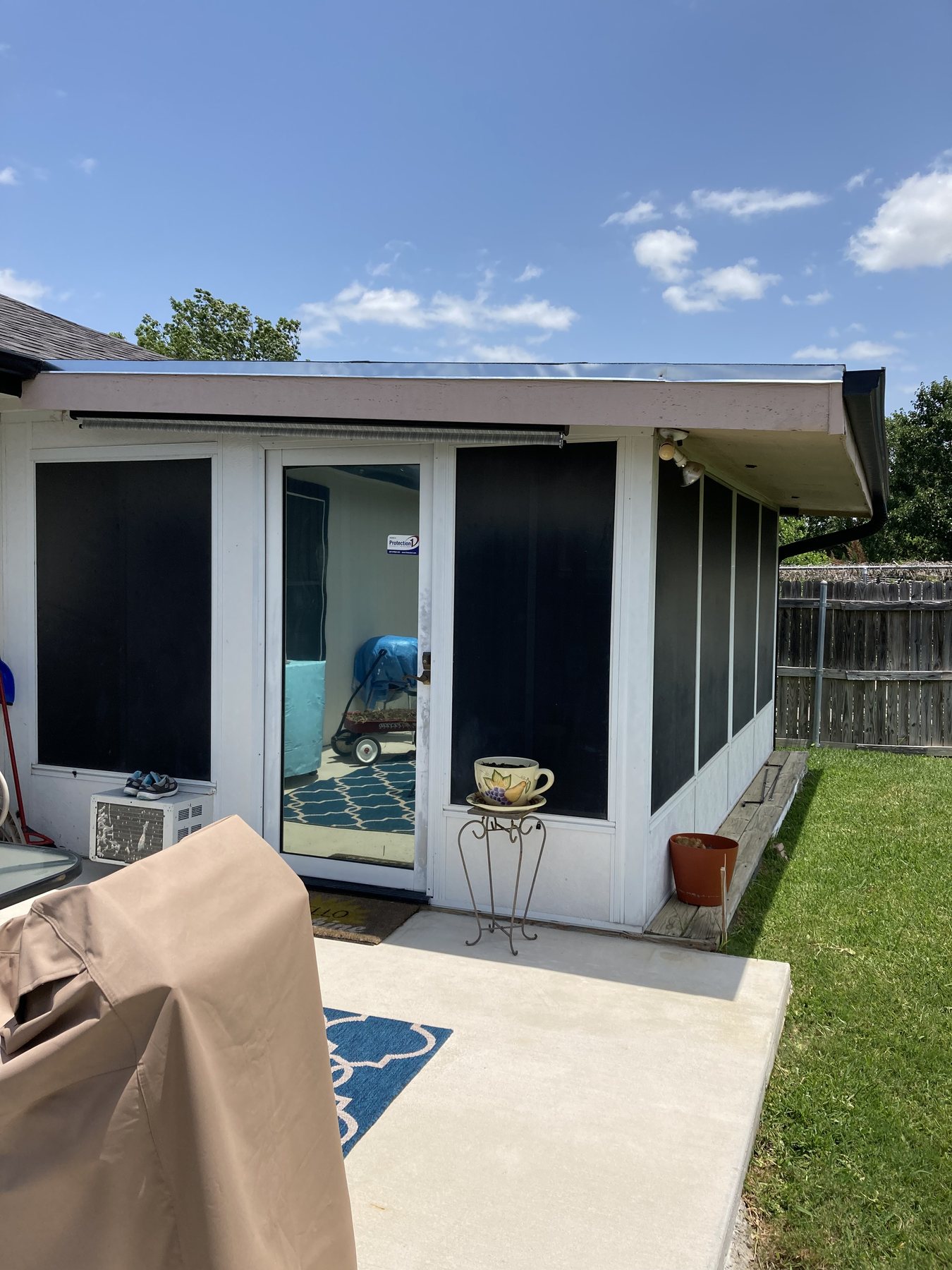 Finished screened patio viewed from the outdoor seating area