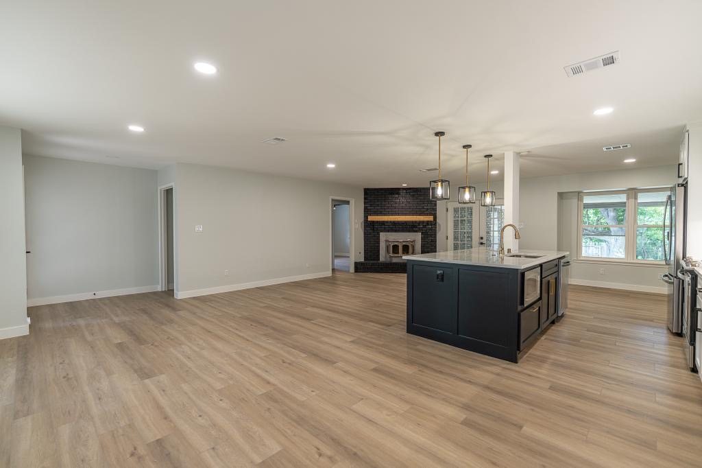 Wide view of the open concept kitchen and living renovation