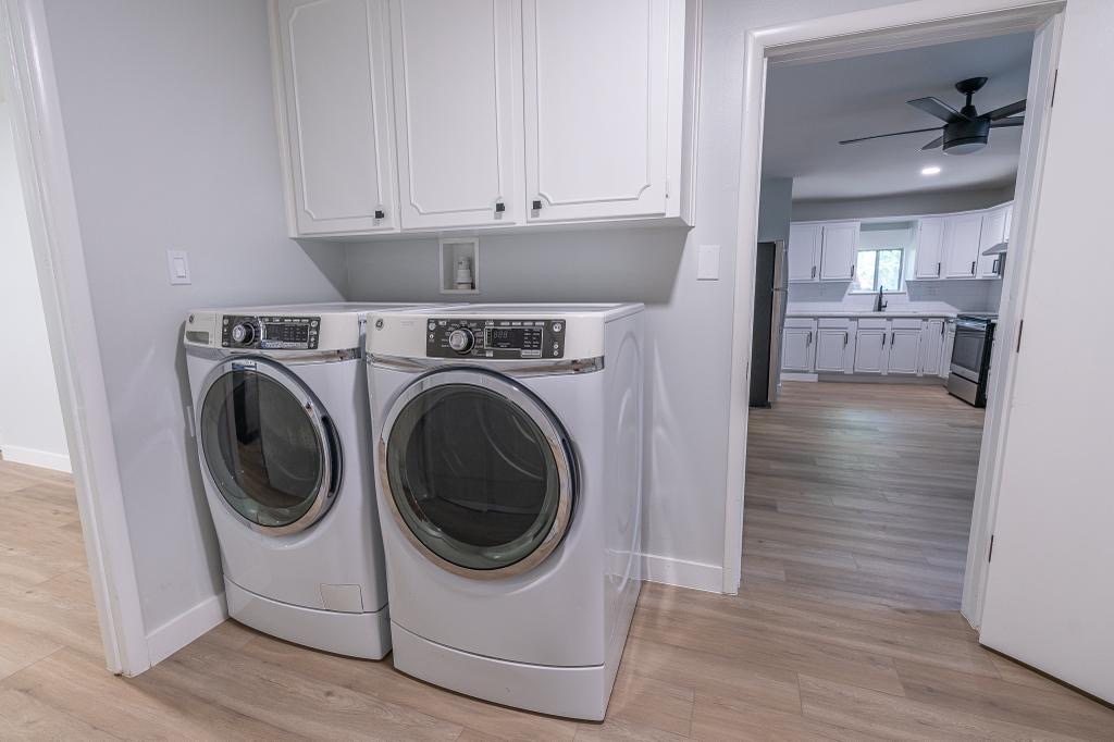 Finished laundry nook with built-in upper cabinets