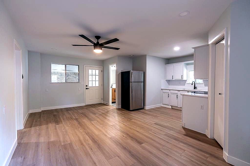 Wide finished view of the open kitchen and living renovation