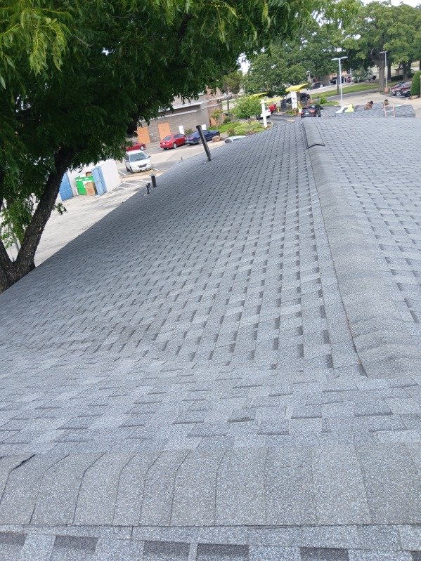Wide view of a finished roof from the peak looking toward the street
